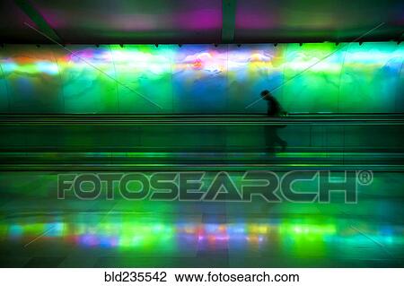 Silhouette of person on moving walkway View Large Photo Image Stock Image - Silhouette of person on moving walkway. Fotosearch
