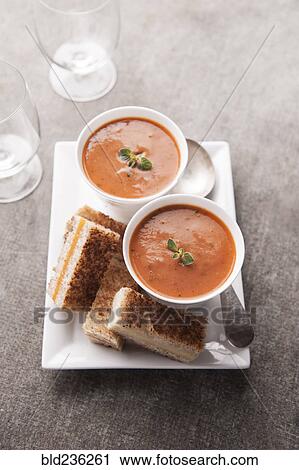 Sliced grilled cheese sandwich and tomato soup View Large Photo Image Stock Image - Sliced grilled cheese sandwich and tomato soup. Fotosearch