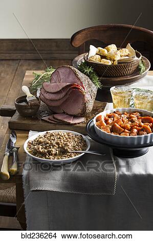 Picture - Sliced ham on buffet table. Fotosearch