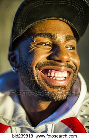 Smiling Black man looking away View Large Photo Image Stock Photo - Smiling Black man looking away. Fotosearch