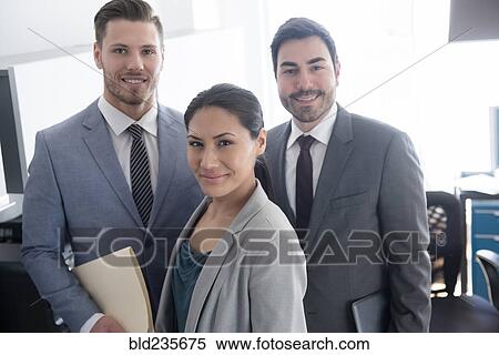 Smiling business people posing in office View Large Photo Image Stock Photography - Smiling business people posing in office. Fotosearch