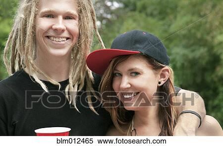 Stock Photography - Smiling Caucasian couple hugging. Fotosearch