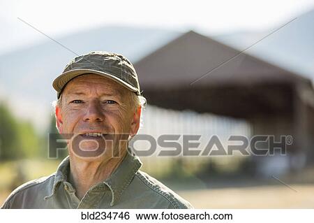 Stock Photograph - Smiling Caucasian farmer. Fotosearch