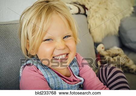 Stock Photo - Smiling Caucasian girl. Fotosearch