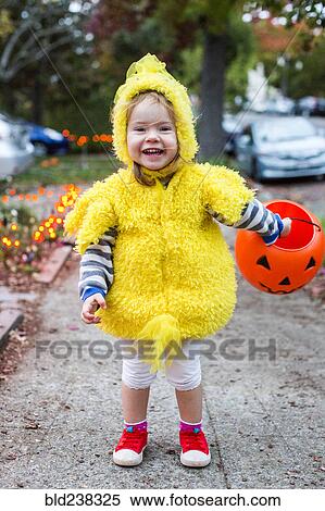 Smiling Caucasian girl wearing chicken costume on Halloween View Large Photo Image Stock Photography - Smiling Caucasian girl wearing chicken costume on Halloween. Fotosearch