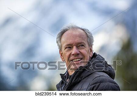 Smiling Caucasian man outdoors View Large Photo Image Picture - Smiling Caucasian man outdoors. Fotosearch