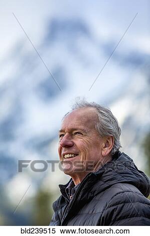 Smiling Caucasian man outdoors View Large Photo Image Stock Photography - Smiling Caucasian man outdoors. Fotosearch