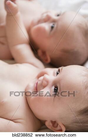 Smiling Caucasian twin baby girls View Large Photo Image Stock Image - Smiling Caucasian twin baby girls. Fotosearch