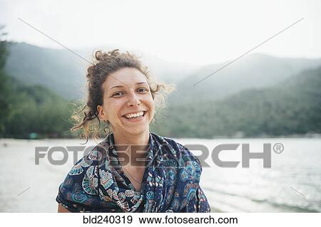 Smiling Caucasian woman at beach View Large Photo Image Stock Photo - Smiling Caucasian woman at beach. Fotosearch