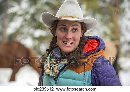 Stock Image - Smiling Caucasian woman in winter. Fotosearch