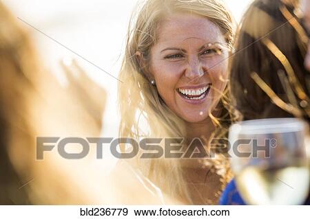Stock Photo - Smiling Caucasian woman outdoors. Fotosearch
