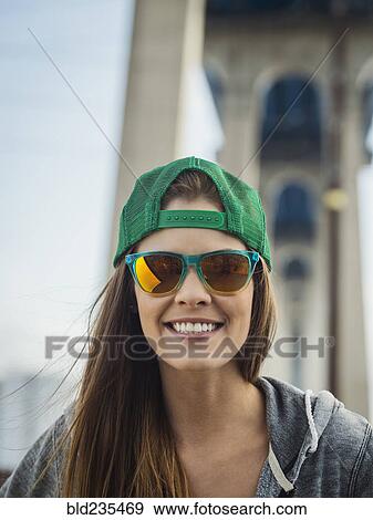 Smiling Caucasian woman posing under overpass View Large Photo Image Stock Photo - Smiling Caucasian woman posing under overpass. Fotosearch