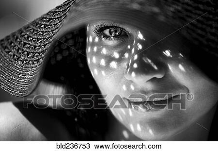 Smiling Caucasian woman wearing sun hat View Large Photo Image Stock Image - Smiling Caucasian woman wearing sun hat. Fotosearch