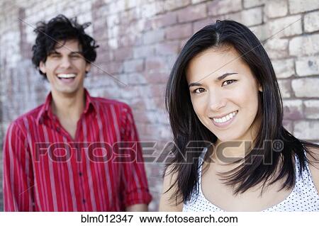Stock Photo - Smiling couple hugging. Fotosearch
