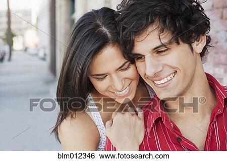 Smiling couple hugging View Large Photo Image Stock Photograph - Smiling couple hugging. Fotosearch
