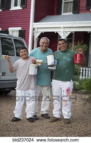 Smiling Hispanic men and boy posing with paint cans and paintbrushes View Large Photo Image Picture - Smiling Hispanic men and boy posing with paint cans and paintbrushes. Fotosearch