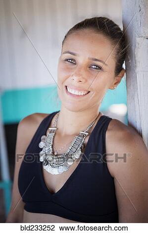 Smiling hispanic woman wearing necklace and bikini View Large Photo Image Stock Image - Smiling hispanic woman wearing necklace and bikini. Fotosearch