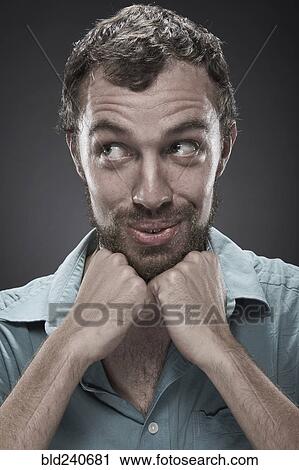 Smiling man with chin in hands View Large Photo Image Stock Image - Smiling man with chin in hands. Fotosearch