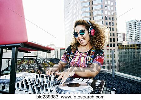 Smiling Mixed Race DJ on urban rooftop View Large Photo Image Stock Image - Smiling Mixed Race DJ on urban rooftop. Fotosearch