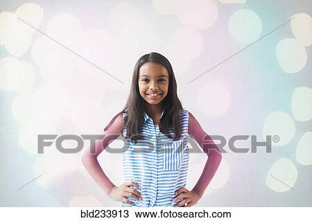 Stock Image - Smiling Mixed Race girl posing. Fotosearch