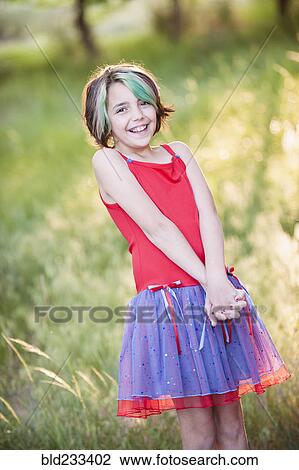 Smiling Mixed Race girl with multicolor hair View Large Photo Image Stock Image - Smiling Mixed Race girl with multicolor hair. Fotosearch