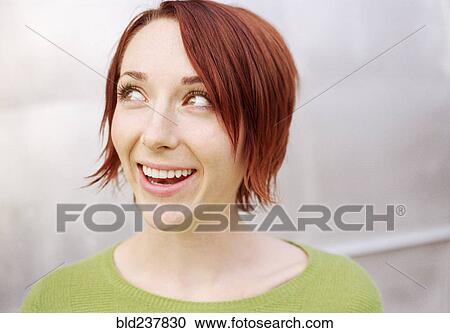 Smiling woman looking away View Large Photo Image Stock Image - Smiling woman looking away. Fotosearch