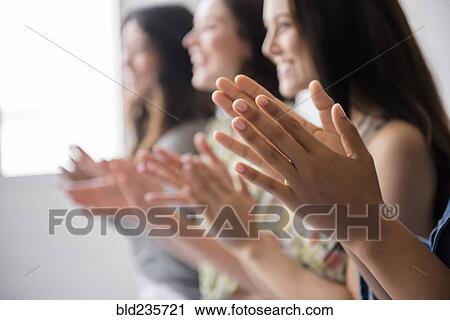 Smiling women applauding View Large Photo Image Stock Image - Smiling women applauding. Fotosearch