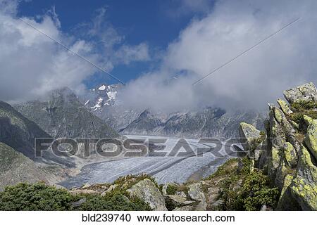 Stock Image - Snow in remote mountain landscape. Fotosearch