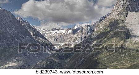 Stock Image - Snow in remote mountain landscape. Fotosearch