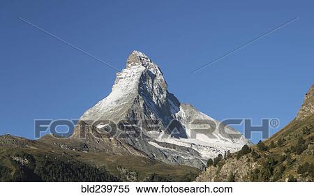 Snow on distant mountain under blue sky View Large Photo Image Stock Photography - Snow on distant mountain under blue sky. Fotosearch