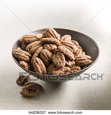 Spicy pecans in bowl View Large Photo Image Stock Photo - Spicy pecans in bowl. Fotosearch