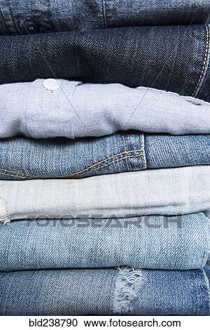 Stack of folded blue jeans View Large Photo Image Stock Image - Stack of folded blue jeans. Fotosearch