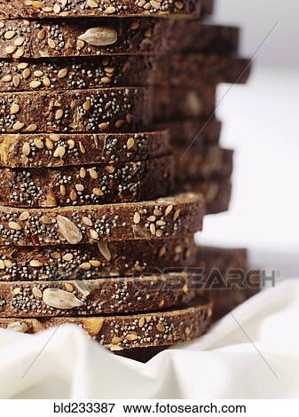 Stack of organic sliced bread with seeds View Large Photo Image Stock Photo - Stack of organic sliced bread with seeds. Fotosearch