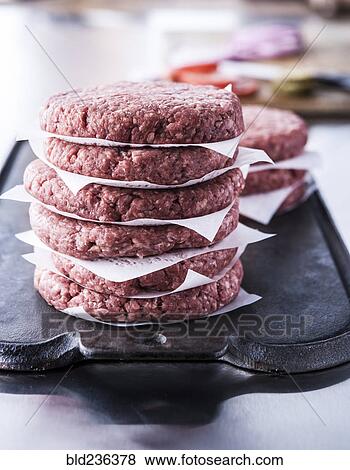 Stack of raw lean ground beef hamburger patties View Large Photo Image Stock Photo - Stack of raw lean ground beef hamburger patties. Fotosearch