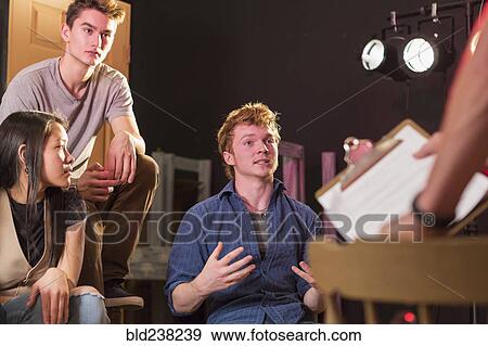 Student talking to teacher in theater class View Large Photo Image Stock Photo - Student talking to teacher in theater class. Fotosearch