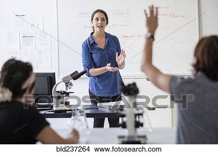Students questioning professor in classroom View Large Photo Image Picture - Students questioning professor in classroom. Fotosearch