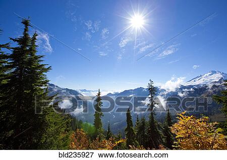 Sun over autumn mountain landscape View Large Photo Image Stock Photo - Sun over autumn mountain landscape. Fotosearch