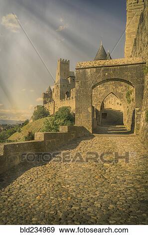 "Sunbeams on road to castle in Carcassonne, Languedoc-Roussillon, France" View Large Photo Image Stock Photo - "Sunbeams on road to castle in Carcassonne, Languedoc-Roussillon, France". Fotosearch