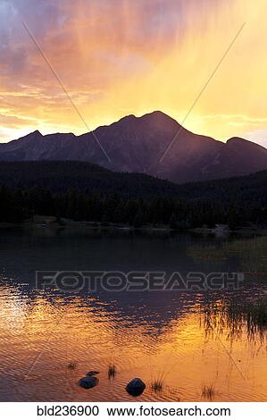 Sunset at mountain lake View Large Photo Image Stock Image - Sunset at mountain lake. Fotosearch