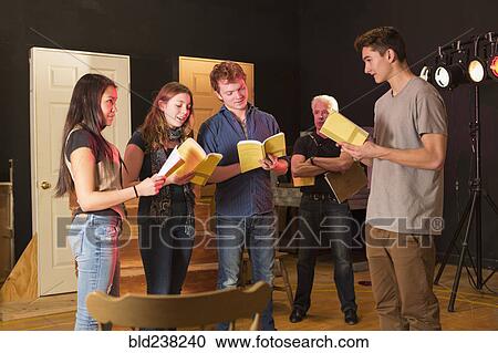 Teacher watching students in theater class View Large Photo Image Stock Image - Teacher watching students in theater class. Fotosearch