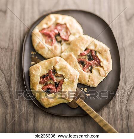Tomato galettes on plate View Large Photo Image Stock Photograph - Tomato galettes on plate. Fotosearch