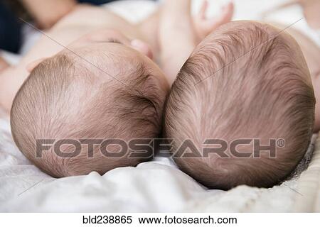 Stock Photography - Top of heads of Caucasian twin baby girls. Fotosearch