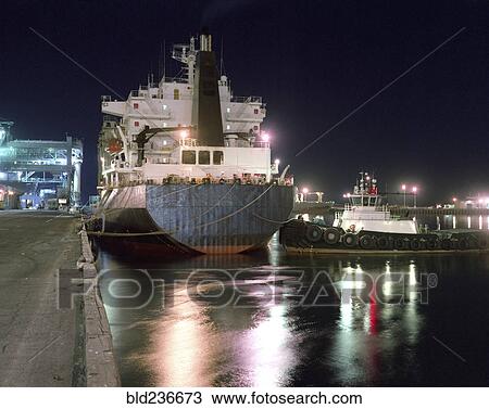 Tugboat and ship moored in harbor View Large Photo Image Stock Image - Tugboat and ship moored in harbor. Fotosearch