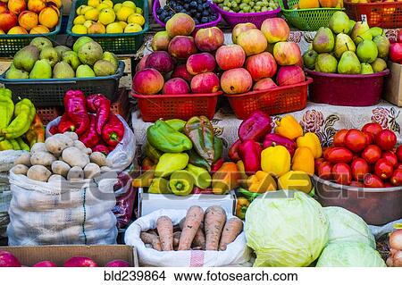 Picture - Variety of fresh fruit and vegetables at market. Fotosearch