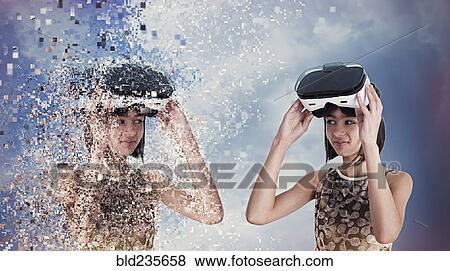 Stock Photo - Virtual replica of Mixed Race girl wearing vr goggles. Fotosearch