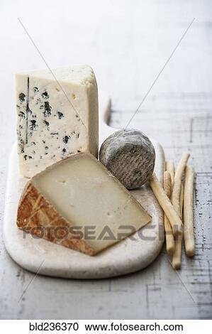 Wedges of cheese and bread sticks View Large Photo Image Stock Image - Wedges of cheese and bread sticks. Fotosearch