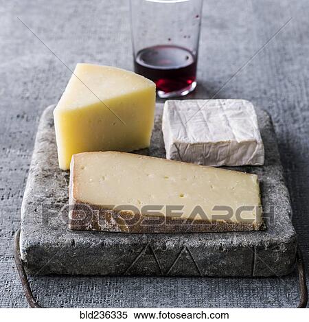 Wedges of cheese and red wine View Large Photo Image Stock Photography - Wedges of cheese and red wine. Fotosearch