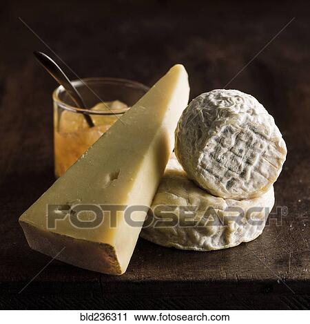 Stock Image - Wedges of cheese and sauce. Fotosearch