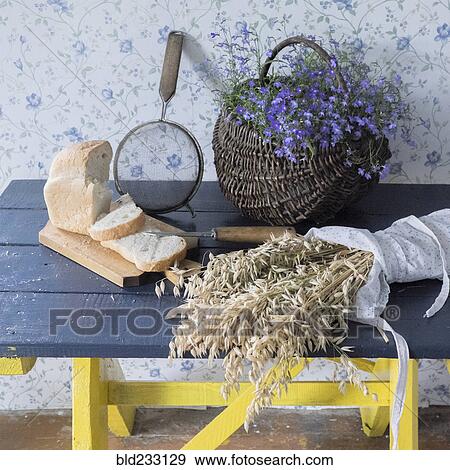 "Wheat, sliced bread, sieve and flowers on bench" View Large Photo Image Stock Photo - "Wheat, sliced bread, sieve and flowers on bench". Fotosearch