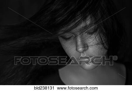 Wind blowing hair of Caucasian woman View Large Photo Image Stock Image - Wind blowing hair of Caucasian woman. Fotosearch
